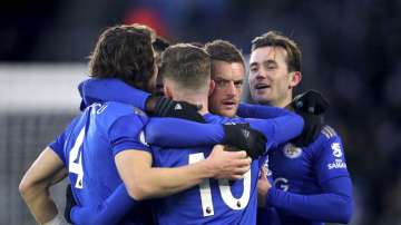 Leicester City's Jamie Vardy, 2nd right, celebrates after Norwich City goalkeeper Tim Krul scored an own goa