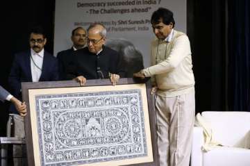 Former President Pranab Mukherjee with former union minister Suresh Prabhu at an event in New Delhi on Monday