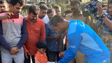 West Indies cricketer Denesh Ramdin with a young fan