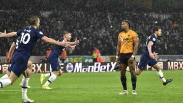 Tottenham's Jan Vertonghen, right, celebrates after scoring his side's second goal during the English Premier League soccer match between Wolverhampton Wanderers and Tottenham Hotspur