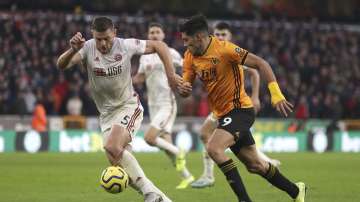 Sheffield United's Jack O'Connell, left, and Wolverhampton Wanderers's Raul Jimenez battle for the ball during the English Premier League soccer match at Molineux