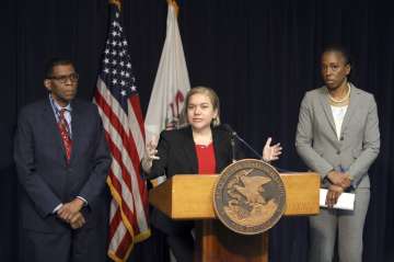 Dr. Allison Arwady, Commissioner, Chicago Department of Public Health, center, speaks at a news conf