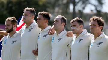 Todd Astle standing right of Trent Boult