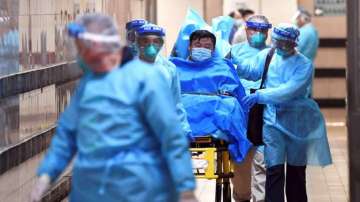 A patient suspected of having contracted coronavirus being taken on a stretcher