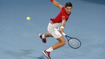 Novak Djokovic of Serbia plays a shot against Rafael Nadal of Spain during their ATP Cup tennis match in Sydney