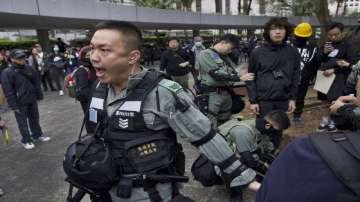 Hong Kong police fire tear gas as thousands rally