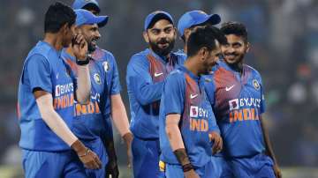 India's Virat Kohli celebrates with teammates after winning the third Twenty20 international cricket match between India and Sri Lanka in Pune