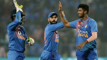 India's Washington Sundar, right and Virat Kohli, center, celebrate after Angelo Mathews' wicket during the third Twenty20 international cricket match between India and Sri Lanka in Pune