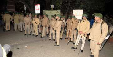 New Delhi: Policemen at out side of the JNU after some masked miscreants attacked in the campus