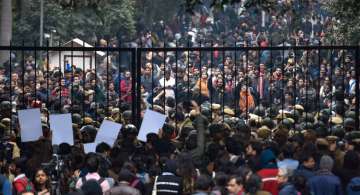 New Delhi: Students stage a protest at main Gate of JNU over Sunday's violence, in New Delhi, Monday, Jan. 6, 2020. A group of masked men and women armed with sticks and rods unleashed violence on the campus of the University in New Delhi, Sunday evening. (PTI Photo/Atul Yadav)