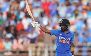 India's Lokesh Rahul looks upwards as he celebrates after scoring fifty runs during the second one-day international cricket match between India and Australia in Rajkot
 