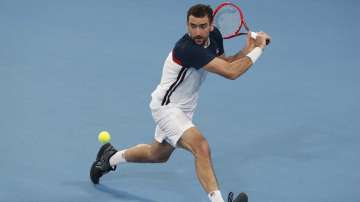 Marin Cilic of Croatia plays a backhand agaisnt Kacper Zuk of Poland during their ATP Cup tennis match in Sydney