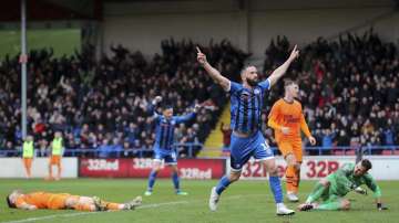 Rochdale's Aaron Wilbraham celebrates scoring his side's first goal of the game during the English FA Cup third round