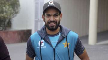 Pakistani cricketer Haris Rauf arrives to talk with media after a practice session in Lahore, Pakistan