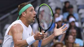 Tennys Sandgren of the U.S. reacts to a line call during his fourth round match against Italy's Fabio Fognini at the Australian Open tennis championship in Melbourne