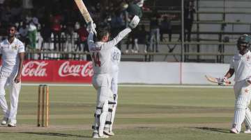 Zimbabwe's Sean Williams celebrates scoring 100 runs during the test cricket match against Sri Lanka at Harare Sports Club, Monday Jan. 27, 2020.