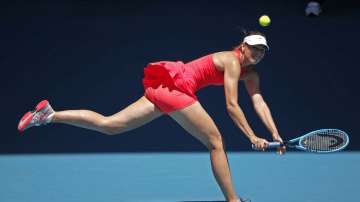 Russia's Maria Sharapova makes a backhand return to Croatia's Donna Vekic during their first round singles match at the Australian Open tennis championship in Melbourne