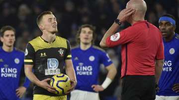 Southampton's James Ward-Prowse, reacts as the referee Lee mason listens to the VAR referee