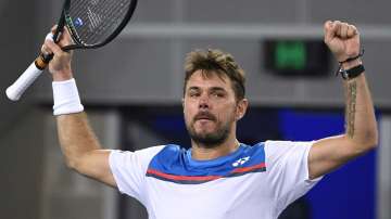 Switzerland's Stan Wawrinka celebrates after defeating Italy's Andreas Seppi in their second round singles match at the Australian Open tennis championship in Melbourne