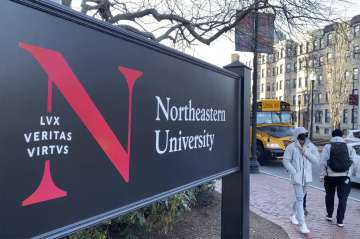 Students walk on the Northeastern University campus in Boston. As concerns about China's virus outb