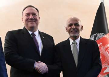 US Secretary of State Mike Pompeo, left, shakes hands with Afghan President Ashraf Ghani,during the 