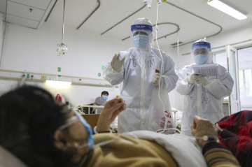 Surge in coronavirus cases takes death toll up to 1,367; China revises method to tally infected