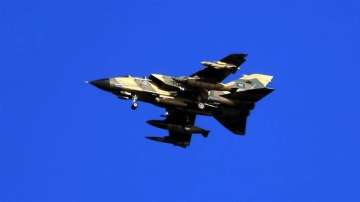 A Saudi Tornado warplane flies over the Gulf during a training mission
