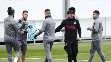 Atletico Madrid's head coach Diego Simone, second right, gestures during a training session in Majadahonda, outskirts of Madrid, Spain, Monday, Feb. 17