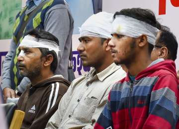 Injured victims of riot-affected areas during a tribute meeting for those who died in communal violence of Northeast Delhi, at Jantar Mantar, in New Delhi, Saturday (PTI)