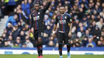 Crystal Palace's Christian Benteke, left, celebrates scoring his side's first goal of the game against Everton, with Jordan Ayew during their English Premier League soccer match at Goodison Park in Liverpool, England, Saturday