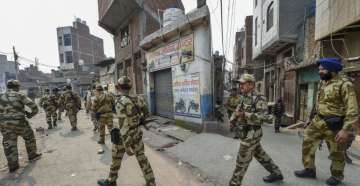 Security personnel patrol streets following clashes over the new citizenship law, in Bhagirathi area