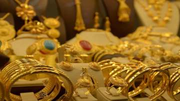 Gold tumbles Rs 954 on strong rupee, global cues