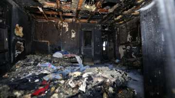 Burned clothes and the interior of a house are destroyed from a fatal fire 