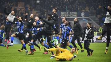 Inter Milan players celebrate after their Serie A soccer match victory over AC Milan at the San Siro Stadium, in Milan, Italy, Sunday, Feb. 9