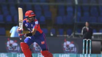 Karachi Kings batsman Babar Azam plays an on drive during his half century against Peshawar Zalmi in the Pakistan Super League match at the National Stadium in Karachi, Pakistan