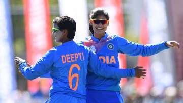 Radha Yadav of India is congratulated by team mates after getting the wicket of Chamari Atapattu of Sri Lanka during the ICC Women's T20 Cricket World Cup match between India and Sri Lanka at Junction Oval on February 29, 2020 in Melbourne, Australia