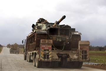 Syrian troops gain territory in push to control key highway