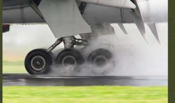 B777 plane had to abort the landing seconds after touchdown after it was caught in strong winds brou