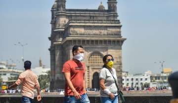 People wear protective masks in view of coronavirus pandemic at the Gateway of India in Mumbai (file photo)
 