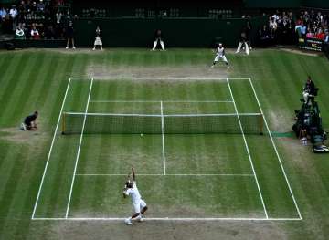 Roger Federer of Switzerland serves during the Men's Singles Final match against Rafael Nadal of Spain on day thirteen of the Wimbledon Lawn Tennis Championships at the All England Lawn Tennis and Croquet Club on July 6, 2008 in London, England