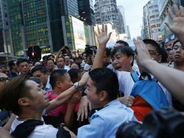 Tourist among 4 charged for Hong Kong anti-govt protest