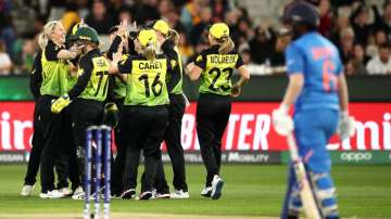 Delissa Kimmince of Australia celebrates with team mates after dismissing Veda Krishnamurthy of India during the ICC Women's T20 Cricket World Cup Final match between India and Australia at the Melbourne Cricket Ground on March 08, 2020 in Melbourne, Australia.