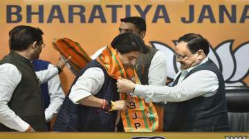  Former Congress leader Jyotiraditya Scindia (C) being felicitated by BJP National President JP Nadd
