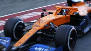 Mclaren driver Carlos Sainz of Spain pulls out of the pit lane during the Formula One pre-season testing session at the Barcelona Catalunya racetrack in Montmelo, outside Barcelona, Spain, Friday, Feb. 28