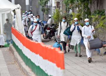 People who showed coronavirus symptoms being taken to various hospitals from Nizamuddin area in New Delhi, Monday, March 30, 2020