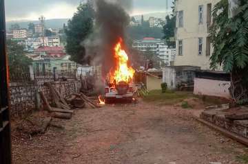 File photo of a vehicle set on fire by protesters agitating against the passing of Citizenship Amend