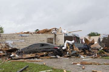 A home had its roof torn off after a tornado ripped through Monroe, La. just before noon on Sunday, 