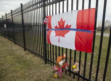 A tribute is displayed Monday, April 20, 2020, at the Royal Canadian Mounted Police headquarters in 