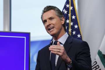 In this file photo taken Tuesday April 14, 2020, California Gov. Gavin Newsom discusses an outline f