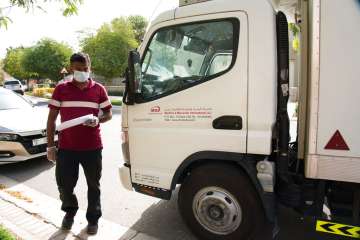 Delivery man leaves after dropping off alcohol at a home in Dubai, United Arab Emirates. Dubai’s two